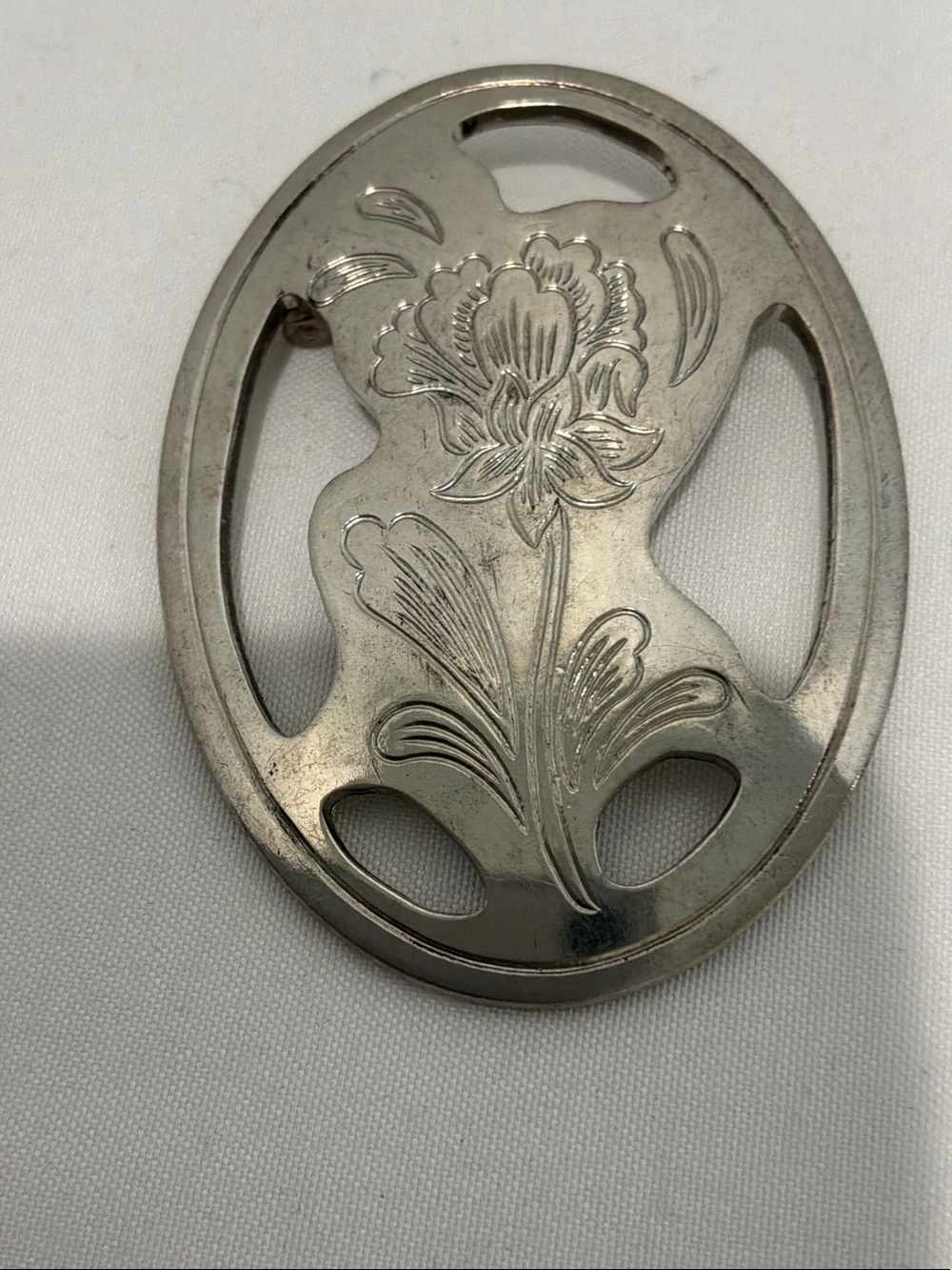 Vintage Kirk Stieff brooch crafted from pewter oval shape etched floral design